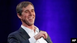 Former Democratic Texas congressman Beto O'Rourke laughs during an interview with Oprah Winfrey on a Times Square stage at "SuperSoul Conversations," Feb. 5, 2019, in New York. O'Rourke dazzled Democrats in 2018 by nearly defeating Republican Sen. Ted Cruz.