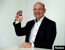 HMD Global President Florian Seiche poses for a photograph with the Nokia 3310 in London, Britain February 24, 2017.
