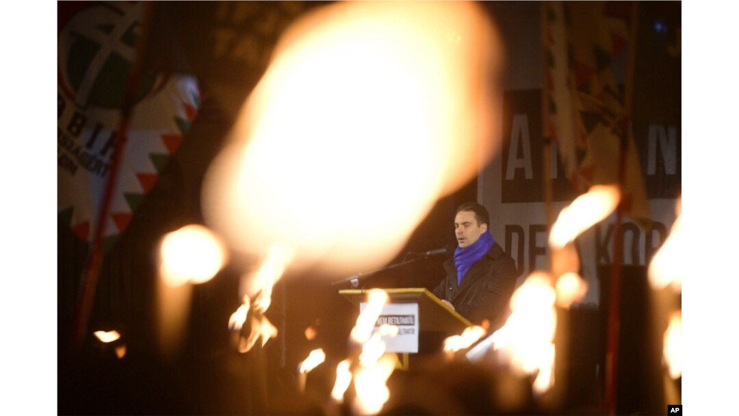 Chairman of opposition Jobbik party of Hungary Gabor Vona delivers his speech during the party's anti-government protest held at the headquarters of Fidesz, the Hungarian Civic Party in Budapest, Hungary, Dec. 15, 2017.