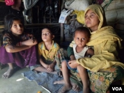 Habiba, 32, and her three children at a Rohingya village in Bangladesh. According to the Rohingya woman, she was raped by a Burmese soldiers and a Mogh, after her husband was beaten up and taken away from her village in Rakhine in December.