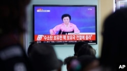 FILE - People watch a TV news program showing North Korea's announcement of a hydrogen bomb test, at the Seoul Railway Station in Seoul, South Korea, Jan. 6, 2016.