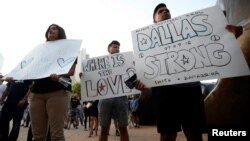 Supporters attend a candlelight vigil at Dallas City Hall following the multiple police shootings in Dallas, Texas, July 11, 2016. 