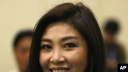 Yingluck Shinawatra, the sister of toppled premier Thaksin Shinawatra, smiles on May 16, 2011 in Bangkok after she was nominated to run for prime minister by the opposition Puea Thai party.