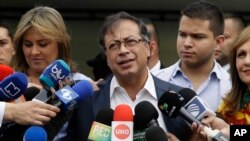 Gustavo Petro, presidential candidate for Colombia Humana, talks with the press after casting his ballot during the presidential election in Bogota, Colombia, June 17, 2018.