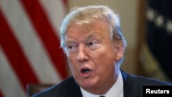 U.S. President Donald Trump speaks during a round-table discussion on border security with state, local and community leaders in the Cabinet Room of the White House in Washington, Jan. 11, 2019.