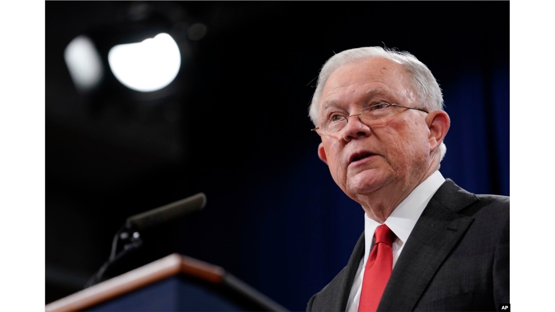 FILE - Then-Attorney General Jeff Sessions speaks during a news conference to announce a criminal law enforcement action involving China, at the Department of Justice in Washington, Nov. 1, 2018.
