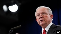 Attorney General Jeff Sessions speaks during a news conference to announce a criminal law enforcement action involving China, at the Department of Justice in Washington, Nov. 1, 2018. 