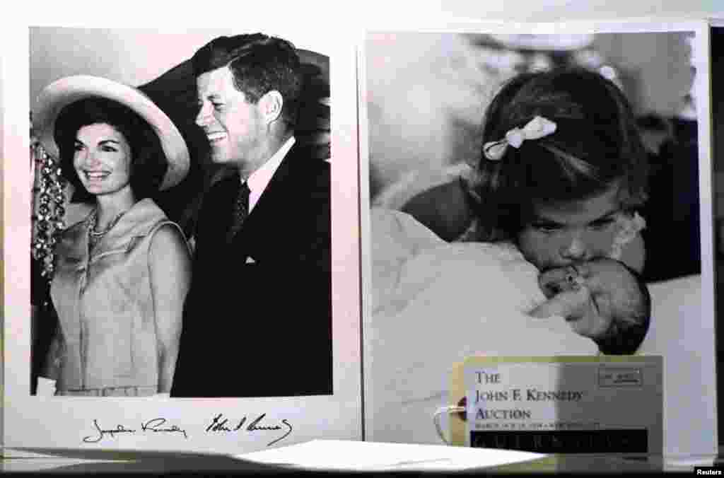 Photographs showing former president John F. Kennedy and his wife Jackie and the couple's children John Jr. and Caroline, on display, March 18, are among the items to be offered at an auction of the late president's momorabilia in New York. 