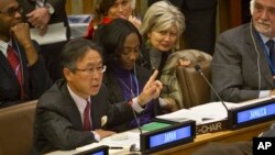 Japan's U.N. Ambassador Motohide Yoshikawa, far left, gestures as he speaks during a meeting of the U.N. General Assembly human rights committee, on a proposal to refer North Korea to the International Criminal Court for alleged crimes against humanity, T