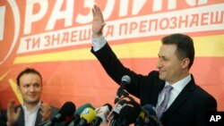 Macedonian Prime Minister and leader of the ruling conservative VMRO-DPMNE Nikola Gruevski greets his supporters while announcing a double victory in parliamentary and presidential elections, in Skopje, Macedonia, Apr. 28, 2014.