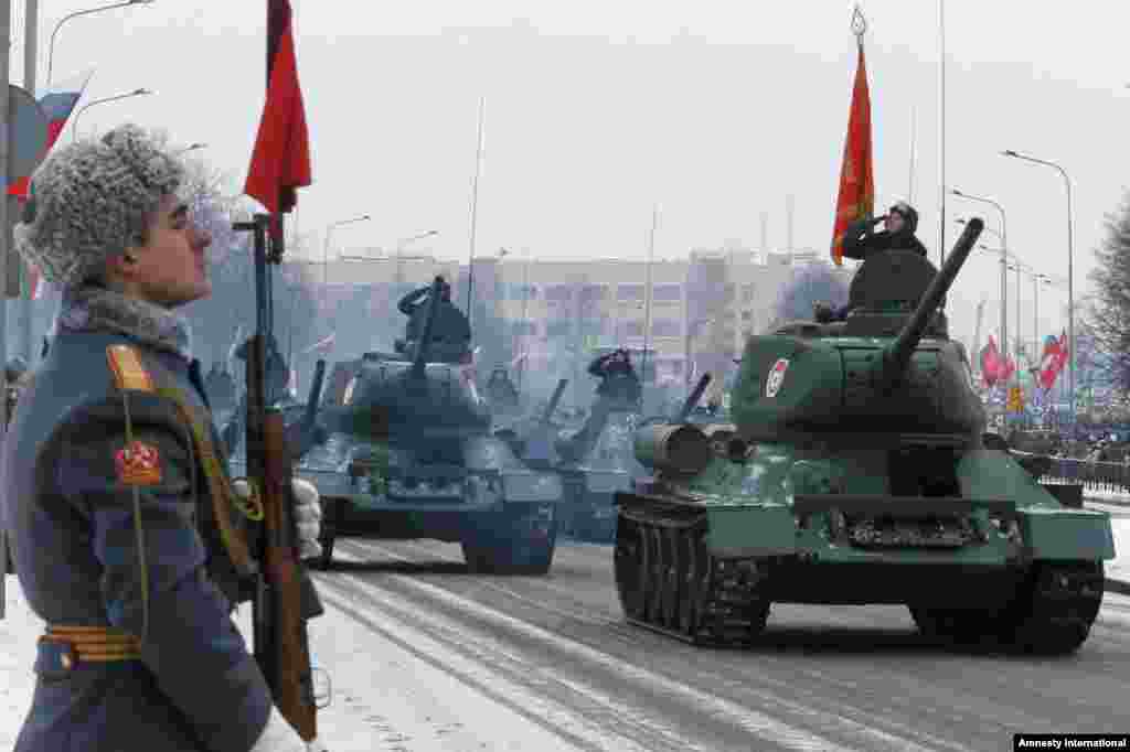 WWII era Soviet tanks T-34 drive during a parade marking the 70th anniversary of the battle that lifted the Siege of Leningrad in St.Petersburg, Russia. More than one million people died, mainly from starvation, during the 900-day siege.