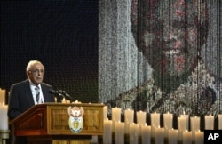 FILE - In this Dec. 15, 2013 file photo, anti-apartheid activist and close friend of Nelson Mandela, Ahmed Kathrada, speaks during the funeral service for the former South African president in Qunu, South Africa.