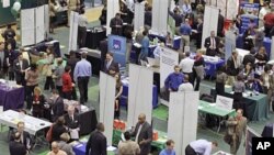 Job seekers pack the aisles of the 32nd Annual Spring Career Fair at Cleveland State University on a day when the jobless report showed employers hired in February at the fastest pace in almost a year, and the unemployment rate fell to 8.9 percent, March 