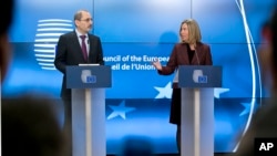 European Union foreign policy chief Federica Mogherini, right, and Jordan's Foreign Minister Ayman Safadi participate in a media conference after a meeting of EU foreign ministers at the Europa building in Brussels, Feb. 26, 2018. 