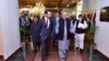 Pakistan's Foreign Minister Shah Mahmood Qureshi (R) talks with US special representative to Afghanistan, Thomas West (L), as they arrive to attend the 'Troika Plus' meeting on Afghanistan, in Islamabad.