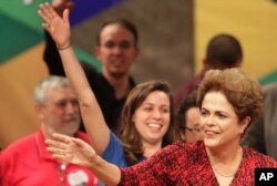 Brazil's suspended President Dilma Rousseff arrives at a rally in Brasilia, Brazil, Aug. 24, 2016.