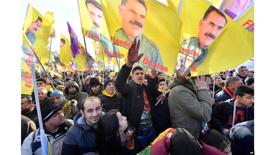 FILE - Pro-Kurdish demonstrators protest against Turkish President Recep Tayyip Erdogan and the political repression that followed July's failed military coup, in Cologne, Germany, Nov. 12, 2016.