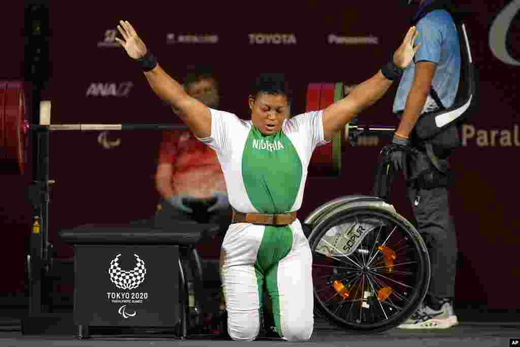 Nigeria&#39;s Folashade Oluwafemiato celebrates after winning a gold medal in women&#39;s -86kg powerlifting final at the Tokyo 2020 Paralympic Games, in Tokyo, Japan. (AP Photo/Kiichiro Sato)