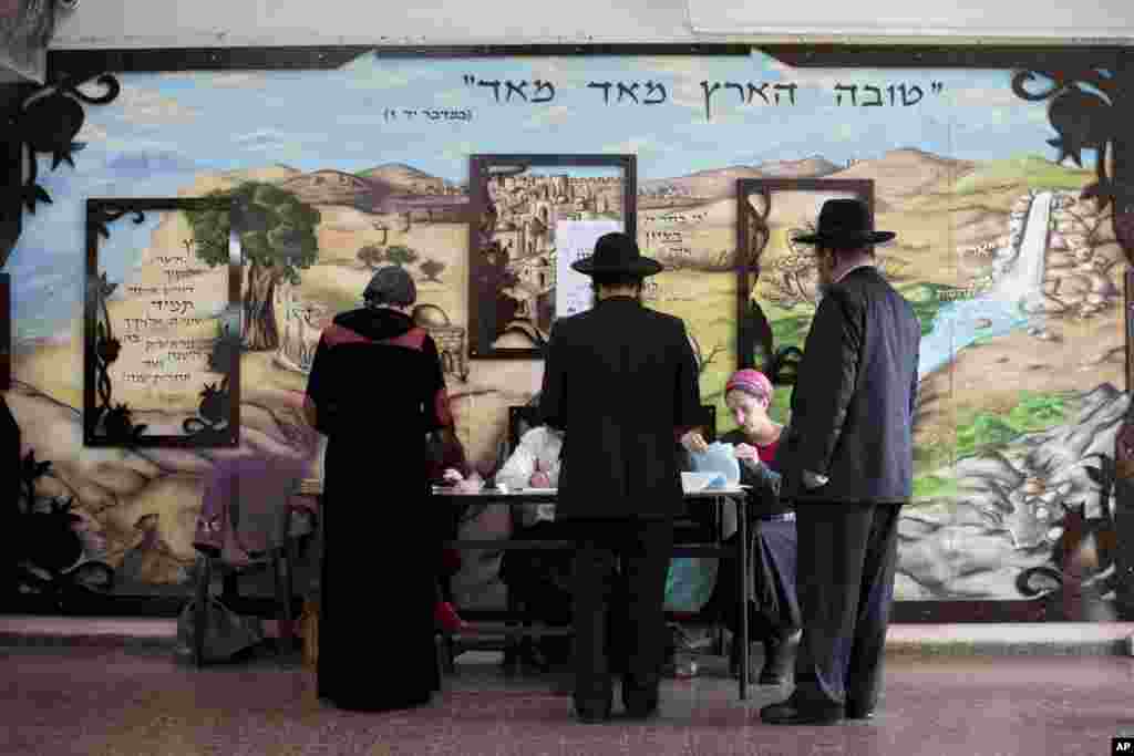 Ultra-Orthodox Jews line up to vote in Bnei Brak, Israel, March 17, 2015.