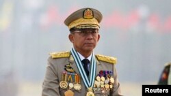 FILE - Myanmar's junta chief Senior General Min Aung Hlaing presides over an army parade on Armed Forces Day in Naypyitaw, Myanmar, March 27, 2021. 