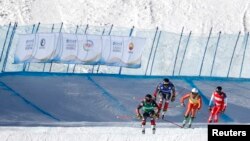 Canada's Brady Leman, Canada's Kristofor Mahler, Russia's Igor Omelin, and Switzerland's Alex Fiva in action during the men's ski cross at the FIS Ski Cross World Cup, Genting Snow Park, Zhangjiakou, China, Nov. 27, 2021. 