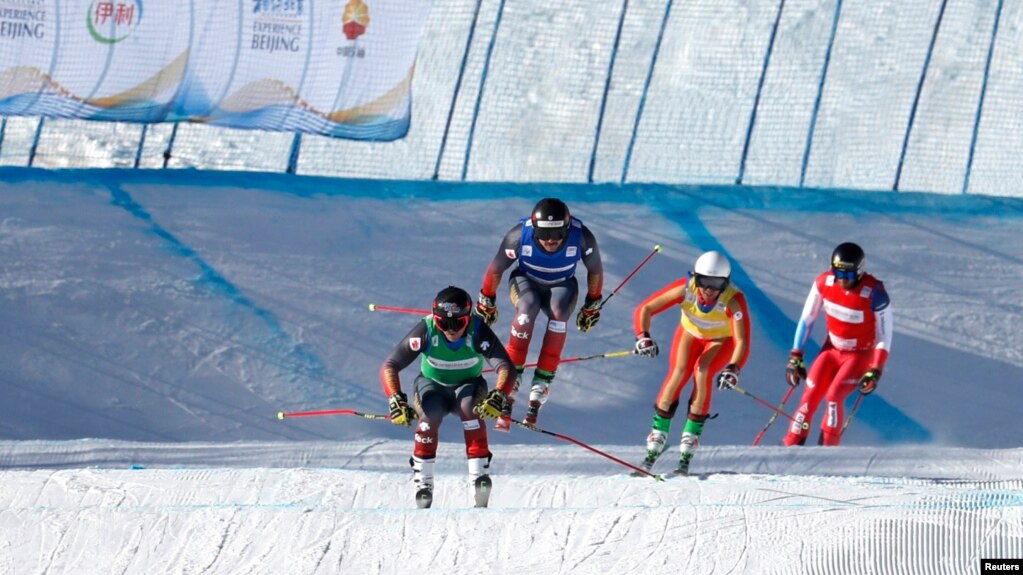 Canada's Brady Leman, Canada's Kristofor Mahler, Russia's Igor Omelin, and Switzerland's Alex Fiva in action during the men's ski cross at the FIS Ski Cross World Cup, Genting Snow Park, Zhangjiakou, China, Nov. 27, 2021. (REUTERS/Tingshu Wang)