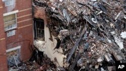 Rubble is seen Friday, March 14, 2014, two days after a natural gas explosion leveled two apartment buildings in New York. 