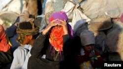 Displaced Yemeni are seen in a makeshift camp near Sana'a, Yemen, Nov. 17, 2017.
