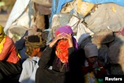 Displaced Yemeni are seen in a makeshift camp near Sana'a, Yemen, Nov. 17, 2017.