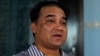 FILE - Outspoken Uighur scholar and advocate Ilham Tohti speaks during an interview at his home in Beijing.