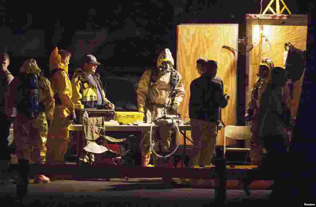 Authorities prepare to search an apartment building in Stamford, Connecticut. Federal agents, bomb squad units and local police searched the Stamford Connecticut residence of Miriam Carey who led law enforcement officers on a dramatic car chase near the White House to the U.S. Capitol. Law enforcement officers shot and killed the driver, media reported.