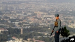 An Afghan police officer on guard in Kabul, Afghanistan.
