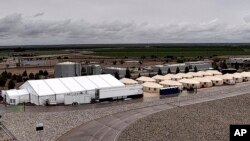 FILE - This undated photo provided by the Administration for Children and Families, a division of the Department of Health and Human Services, shows the shelter used to house unaccompanied migrant children in Tornillo, Texas.