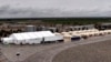 FILE - This undated photo provided by the Administration for Children and Families, a division of the Department of Health and Human Services, shows the shelter used to house unaccompanied migrant children in Tornillo, Texas. 