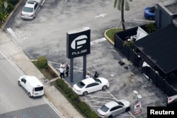 Investigators work the scene following a mass shooting at the Pulse gay nightclub in Orlando Florida, U.S., June 12, 2016.