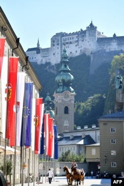 A picture taken on September 18, 2018 shows European flags displayed on a street outside the Hofstallgasse, on the eve of the start of a two-day European Summit on migration and Brexit in Salzburg.