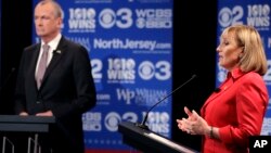 Republican nominee Lt. Gov. Kim Guadagno, right, answers a question during a gubernatorial debate against Democratic nominee Phil Murphy at William Paterson University, Oct. 18, 2017, in Wayne, N.J.