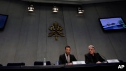 FILE - Rene Brulhart (L), director of the Financial Information Authority, an institution established to monitor the monetary and commercial activities of Vatican agencies, and Vatican spokesman Federico Lombardi, are seen at the Vatican, May 22, 2013.