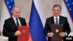 O'zbekiston Prezidenti Shavkat Mirziyoyev (o'ngda) Rossiya rahbari Vladimir Putin bilan, Toshkent, O'zbekiston, 2018-yil, 19-oktabr