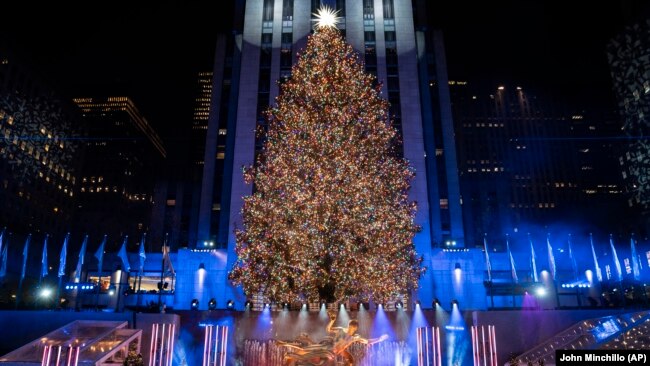 The Rockefeller Center Christmas tree stands lit at Rockefeller Center during the 89th annual Rockefeller Center Christmas tree lighting ceremony on December 1, 2021, in New York. (AP Photo/John Minchillo, File)