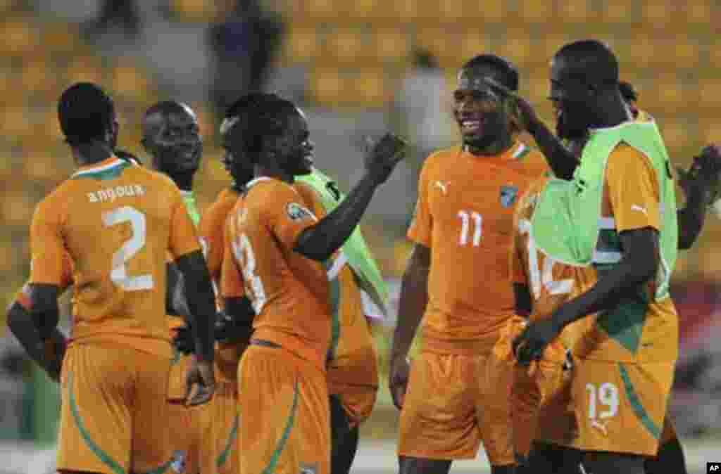 Ivory coast's players celebrate their win after their African Nations Cup soccer match against Angola at Estadio de Malabo "Malabo Stadium", in Malabo January 30, 2012. At second right is Didier Drogba.