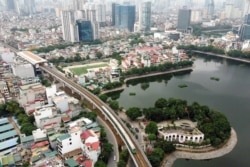 FILE - An aerial photograph shows the first urban metro train running along the Cat Linh-Ha Dong line, in Hanoi, Vietnam, Nov. 6, 2021.
