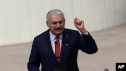 FILE - Prime Minister Binali Yildirim speaks after Turkey's parliament approved a contentious constitutional reform package, in Ankara, Jan. 21, 2017.