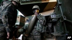 FILE - South Korean marines prepare for their regular drill on Yeonpyeong Island, South Korea, Nov. 1, 2018. 