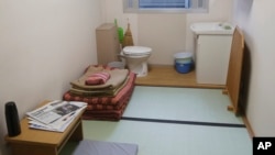 A solitary cell for inmate is opened to the media during a press tour in Tokyo, Monday, June 10, 2019. (AP Photo/Koji Sasahara)