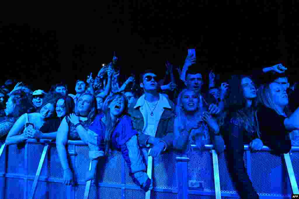 Fans watch Blossom perform at a live music concert hosted by Festival Republic in Sefton Park in Liverpool, north-west England, May 2, 2021, where a non-socially-distanced crowd of 5,000 are expected to attend.