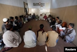 HIV patients take part in an awareness session at Pakistan Society, a nongovernmental organization drop-in center, in Karachi, Nov. 30, 2013.