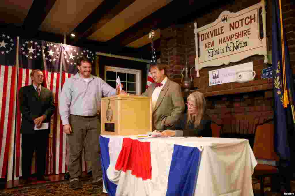 Clay Smith is the first to cast his ballot in the U.S. presidential election at midnight in tiny Dixville Notch, New Hampshire.