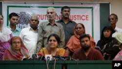 FILE - Teesta Setalvad, center, appears at a press conference in Ahmadabad, India. India has restricted activities by the US-based Ford Foundation because of its suport of an NGO founded by Setalvad.