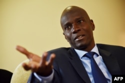 FILE - President Jovenel Moise, then the Haitian presidential candidate of PHTK Political Party, speaks during an interview with AFP in Port-au-Prince, Sept. 6, 2016.